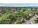 Aerial view of the property showcasing a well-maintained home surrounded by lush greenery and mature trees at 8966 Sunridge Hollow Rd, Parker, CO 80134