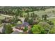 Scenic aerial view of a home featuring a well-maintained yard, mature trees, and a deck with a hot tub at 8966 Sunridge Hollow Rd, Parker, CO 80134