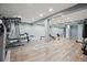Finished basement featuring workout area with weight training equipment and durable flooring at 8966 Sunridge Hollow Rd, Parker, CO 80134