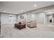 Finished basement with recessed lighting, neutral carpet, and a cozy seating area with an exposed support beam at 8966 Sunridge Hollow Rd, Parker, CO 80134