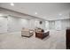 Spacious finished basement with neutral carpet, recessed lighting, and a cozy seating area at 8966 Sunridge Hollow Rd, Parker, CO 80134
