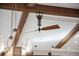 Unique ceiling fan and exposed beam work adds character to the house's interior at 8966 Sunridge Hollow Rd, Parker, CO 80134