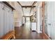 Spacious entryway with hardwood floors, wooden beams, and stylish decor creating a warm welcome at 8966 Sunridge Hollow Rd, Parker, CO 80134