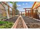Close-up view of the raised garden beds with irrigation system, providing an organized and efficient gardening setup at 8966 Sunridge Hollow Rd, Parker, CO 80134