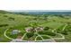 Aerial view of a lush community park featuring walking trails and playground at 4555 Gray Wolf Ln, Castle Rock, CO 80104