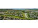 Aerial view of a community with a golf course, lake, and mountain views at 4555 Gray Wolf Ln, Castle Rock, CO 80104
