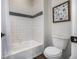 Clean bathroom with a white tiled tub, and neutral accents providing a refreshing and functional space at 4555 Gray Wolf Ln, Castle Rock, CO 80104