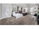 Open bedroom featuring a bed, kitchenette, seating area and modern decor at 4555 Gray Wolf Ln, Castle Rock, CO 80104