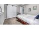 Bedroom featuring a modern bed, sliding closet doors, and a mirror at 4555 Gray Wolf Ln, Castle Rock, CO 80104