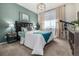 Serene bedroom with soothing teal walls, plush bedding, and a telescope creates a relaxing retreat at 4555 Gray Wolf Ln, Castle Rock, CO 80104