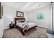 Comfortable bedroom features a plush bed, stylish decor, and natural light at 4555 Gray Wolf Ln, Castle Rock, CO 80104