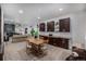 Open dining area with dark cabinets, wood countertop, and spacious living area at 4555 Gray Wolf Ln, Castle Rock, CO 80104