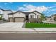 Charming single Gathering home with stone accents, three-car garage, and a well-manicured front yard at 4555 Gray Wolf Ln, Castle Rock, CO 80104