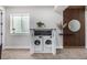 Laundry room featuring modern washer and dryer and decorative shelving at 4555 Gray Wolf Ln, Castle Rock, CO 80104