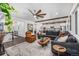 Spacious living room boasts a modern design, seamlessly connecting to the kitchen and staircase at 4555 Gray Wolf Ln, Castle Rock, CO 80104