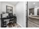 Efficient home office with a black desk, PC setup, and a comfortable chair offers a productive workspace at 4555 Gray Wolf Ln, Castle Rock, CO 80104