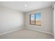 Bedroom featuring plush carpet, a neutral wall color and a window at 17962 E 94Th Pl, Commerce City, CO 80022