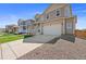 Modern home design with a two-car garage, complimented by a manicured lawn at 3337 Belleville Ridge Rd, Elizabeth, CO 80107