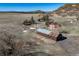 Aerial view of rustic home with a barn and surrounding landscape at 4586 Best Rd, Larkspur, CO 80118