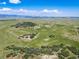 Picturesque property with rolling hills offers a serene and private setting with mountain views at 4586 Best Rd, Larkspur, CO 80118