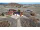 Aerial view of a home with solar panels, large garages and serene countryside at 4586 Best Rd, Larkspur, CO 80118