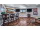 The finished basement boasts bar seating with backyard views at 4586 Best Rd, Larkspur, CO 80118