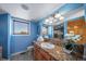 Charming bathroom boasting granite countertop and views of the surrounding landscape at 4586 Best Rd, Larkspur, CO 80118