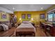 Comfortable bedroom offering a restful retreat, enhanced by a built-in bookcase and work space at 4586 Best Rd, Larkspur, CO 80118