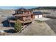 Aerial elevation of home highlighting wrap around deck, solar panels, and garage at 4586 Best Rd, Larkspur, CO 80118