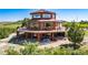 Unique home with a wrap around deck and ample outdoor space to enjoy the beautiful mountain views at 4586 Best Rd, Larkspur, CO 80118