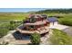 Beautifully designed home with solar panels, a spacious deck, and an inviting outdoor living space at 4586 Best Rd, Larkspur, CO 80118