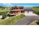 Stunning two-story home boasts solar panels and a spacious deck perfect for outdoor entertaining at 4586 Best Rd, Larkspur, CO 80118