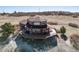 Aerial view highlighting wrap around deck with home's elevated construction at 4586 Best Rd, Larkspur, CO 80118