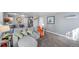 Comfortable living room with gray sofa, hardwood floors, and bright interior at 4586 Best Rd, Larkspur, CO 80118