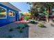 Landscaped backyard with gravel, plants, and a wooden fence at 1497 S Fairfax St, Denver, CO 80222