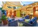 Relaxing backyard patio area with stylish seating, outdoor lighting, and lush greenery at 1497 S Fairfax St, Denver, CO 80222