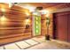 Inviting entryway featuring warm wood accents, a bright green door, and modern lighting at 1497 S Fairfax St, Denver, CO 80222
