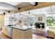 Bright open floor plan with kitchen island, dining area, and cozy living space at 1497 S Fairfax St, Denver, CO 80222