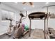 Basement workout space with stationary bike, elliptical and treadmill perfect for fitness enthusiasts at 19939 E Belleview Ln, Centennial, CO 80015