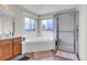 Bright bathroom featuring a large soaking tub, separate shower, and a vanity at 19939 E Belleview Ln, Centennial, CO 80015