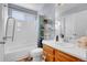 Clean bathroom with a tub and shower combination with a built-in soap dish at 19939 E Belleview Ln, Centennial, CO 80015