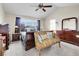 Inviting bedroom with a vaulted ceiling, ceiling fan, and tasteful decor with lots of light at 19939 E Belleview Ln, Centennial, CO 80015