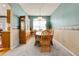 Cozy dining room featuring a classic hutch, large window, and traditional decor at 19939 E Belleview Ln, Centennial, CO 80015