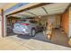 Spacious two-car garage with ample storage and a vehicle inside, providing convenient parking and organization at 19939 E Belleview Ln, Centennial, CO 80015