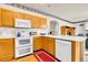 Kitchen features ample counter space, modern appliances, and hardwood floors at 19939 E Belleview Ln, Centennial, CO 80015