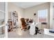 Bright office space with a large window, bookshelf and a functional workspace at 19939 E Belleview Ln, Centennial, CO 80015