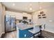 Kitchen with granite countertops, stainless appliances and island with barstool seating at 4781 Rosette St, Castle Rock, CO 80104