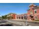 Classic brick fire station building with visible garage doors, an American flag and mountain views at 4781 Rosette St, Castle Rock, CO 80104