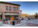 Charming Castle Cafe building with brick facade, outdoor seating, and picturesque mountain views at 4781 Rosette St, Castle Rock, CO 80104