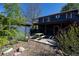 Backyard view featuring a deck, picnic table, and a separate storage shed at 1424 Cypress Cir, Lafayette, CO 80026